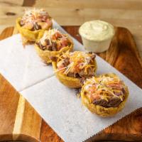 Bistec Mofonguitos · Grilled Steak 4) plantains cups with garlic sauce topped with pico de gallo, mixed shredded ...