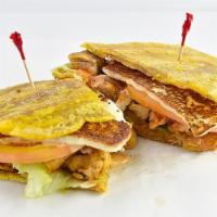 Pollo a la Parrilla Patacones · Grilled chicken.
Fried Green Plantain sandwich with Grilled Cheese topped with lettuce, toma...