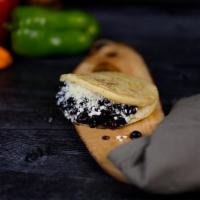 Arepa Domino. · Black beans, cotija cheese, Guasacaca sauce and love.