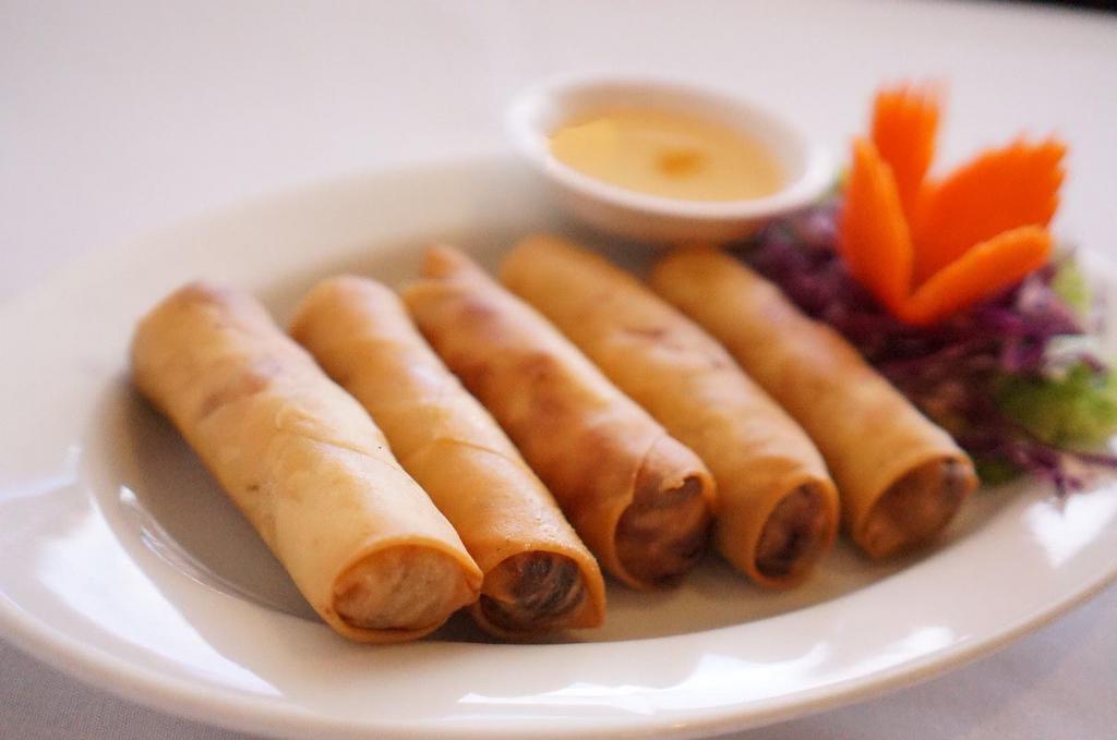 Crispy Spring Roll · Wrapped with shrimp, ground chicken, jelly noodles, carrot and cabbage, served with plum sauce.