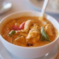 Red Curry  · Choice of meat in red curry and coconut milk sauce, accompanied with onions and bamboo shoots.