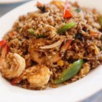 Spicy Basil Fried Rice · Fried rice with chilli paste sauce and sweet basil with choice of pork, chicken or beef.