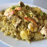 Pineapple Fried Rice · Fried rice with chunks of pineapple and combination of chicken, shrimp and cashew nuts.