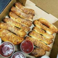 What Up Dough Stix (12pc) · Freshly baked bread topped with butter, garlic & parmesan romano. 
Served with pizza sauce s...
