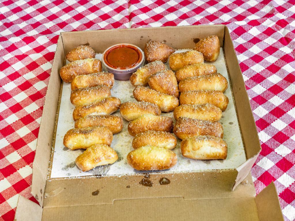 Cajun Dough Stix (12pc) · Freshly baked bread topped with butter, garlic , cajun & parmesan romano. Served with pizza sauce side