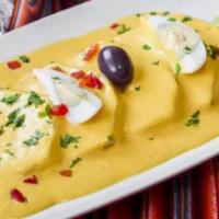 Papa a la Huancaína · Served with huancaina cheese spicy sauce.