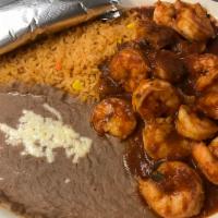 Macho Shrimp · Served in hot homemade special sauce with rice and beans.