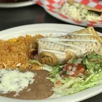 30. Shrimp Chimichanga · Crispy burrito with shrimp filling deep-fried in a tortilla and topped with cheese, lettuce,...