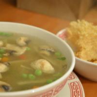 Sizzling Rice Soup · 32 oz. Sliced chicken, shrimp, ham and vegetables with deep-fried rice crust in chicken broth.