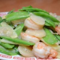 Snow Pea Prawns · Sauteed prawns with snow peas, water chestnuts and bamboo shoots in white wine garlic sauce.