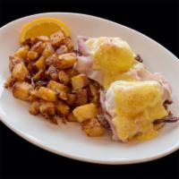 The Cadillac Benedict Breakfast · Bacon, shaved ham, poached eggs, toasted English muffin, Hollandaise and Cadillac potatoes.