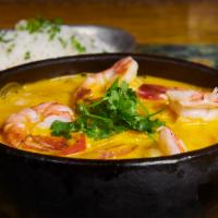 Moqueca de Peixe · Fish and shrimp stew in palm oil and coconut milk, rice, fish flour gravy