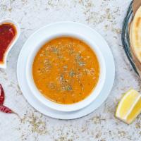 Lentil Soup (Ezogelin Çorba) · Red lentils combined with pureed garlic, celery, carrots, and onions. Comes with a pita bread.