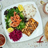 Fillet of Salmon · Grilled fresh fillet of salmon topped with a marinated dill sauce. 

Comes with red cabbage,...