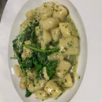Gnocchi D’este · Served with garlicky spinach, extra virgin olive oil and broccoli rapi.