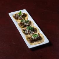 Tacos del Pueblo · Chopped fajita beef, onions, jalapenos, and cilantro y queso fresco on a corn tortilla. Serv...