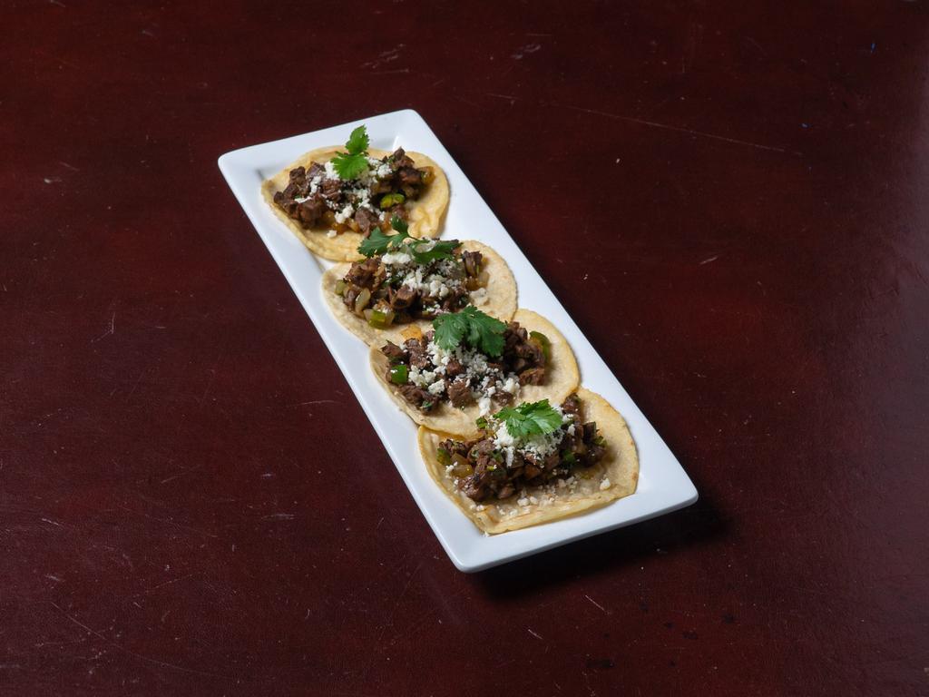 Tacos del Pueblo · Chopped fajita beef, onions, jalapenos, and cilantro y queso fresco on a corn tortilla. Served with rice and black beans.