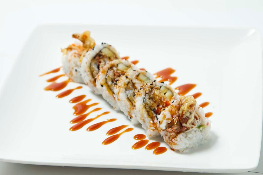 Spider Roll · Softshell crab, crab meat, avocado, cucumber inside with masago, eel sauce on top