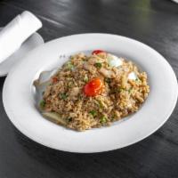 House Fried Rice Dinner · Onions, green peas, carrots, tomatoes, scallions, and egg.
