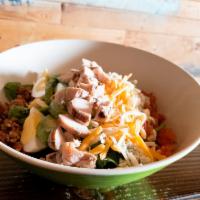 Cobb Salad · Egg, bacon, avocado, mixed cheese, crumble blue cheese, tomatoes and grilled chicken, on a b...