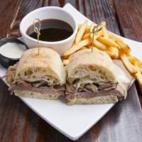 French Dip · Sliced Roast rib, sauteed mushrooms, caramelized onions and Swiss cheese on a ciabatta bread...