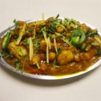Aloo Sholle  · Garbanzo beans and potatoes cooked in special blend of spices.