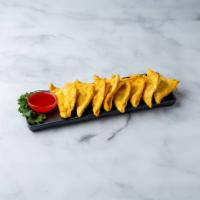 27. Crab Rangoons · 8 pieces  triangle shaped wonton filled with cream cheese and crabmeat served with sweet and...