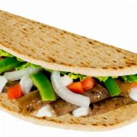 Saprino's Gyro Sandwich · A delicious Gyro meat, tomatoes, onions and green peppers served in a pita bread and topped ...