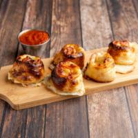Pizza Rolls · Homemade dough, pepperoni, green onions, ranch, mozzarella, garlic and Parmesan. Served with...