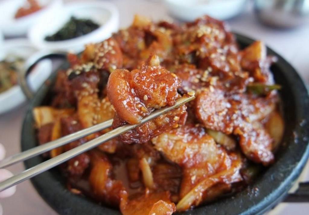 Jae Yook- Spicy pork · Marinated in Boka spicy sauce with pork and vegetables. Comes with side of rice