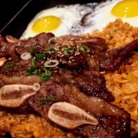 Boka Steak and Eggs · BBQ short ribs over kimchi fried rice and 2 eggs sunny-side up.