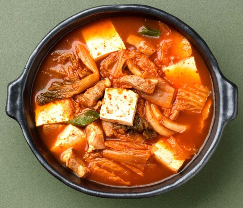 Kimchi Chi Gae Soup · Kimchi stew with tofu, pork belly, and rice cake. Comes with side of rice