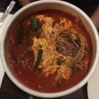 Yook Gae Jang Soup · Spicy shredded flank steak, vegetables, and glass noodles. Comes with side of rice