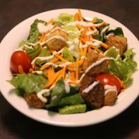 House Salad · Romaine lettuce, carrots, cherry tomato, and house-made croutons. Served with choice of dres...