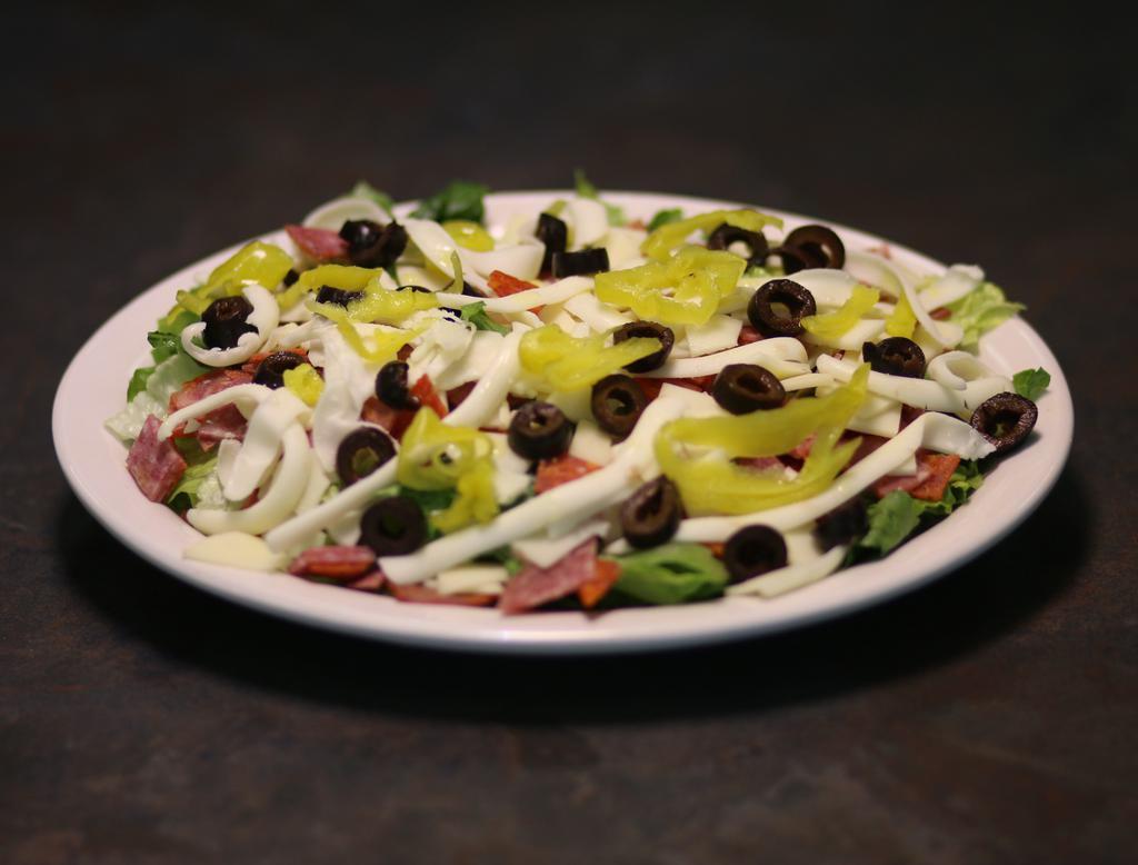 Anti Pasta Salad · Romaine lettuce topped with salami, pepperoni, capicola, ham, provolone, and mozzarella cheese, black olives, and pepperoncini peppers. Served with house Italian dressing.

