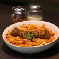 Baked Penne Meatball Marinara · Penne pasta baked with housemade meatballs, house marinara, and mozzarella cheese. Topped wi...