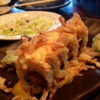 Monster Roll · In: shrimp tempura and spicy tuna. Top: spicy crab and crispy onion. Sauce: eel sauce and sp...