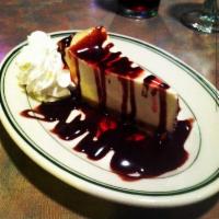 New York Cheesecake · Topped with your choice of chocolate, raspberry, or caramel sauce
