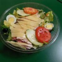Chef's Salad · Mixed greens, julienne slices of turkey breast, rare roast beef and salami and Swiss cheese ...