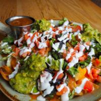 House Nachos · Cheddar bechamel, melted cheddar, lettuce, tomato, guacamole, sour cream and salsa fresca.