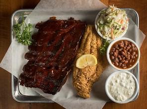 Ribs & Catfish Combo · 1/2 slab of ribs with a catfish filet, baked beans, coleslaw, tartar sauce and a roll.
