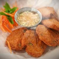 Fish Cake · 5 pieces. Thai fried fish cake is made with fresh fish paste, green beans red curry paste an...