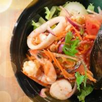 Seafood Salad · A combination of shrimps, squids, scallops and mussels mixed with lime juice, onion, tomatoe...