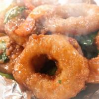 Crispy Calamari with Basil · Fresh squid tossed in batter and deep fried then sauteed with ground fresh chili paste, basi...