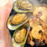 Deep Sea Sizzling Combo · Shrimp, scallops, squid, and mussels stir-fried with egg, baby corn, onions, scallions, carr...