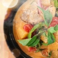 Duck Red Curry · Boneless duck in our Red curry sauce with basil leaves, bell peppers, tomatoes, pineapple an...