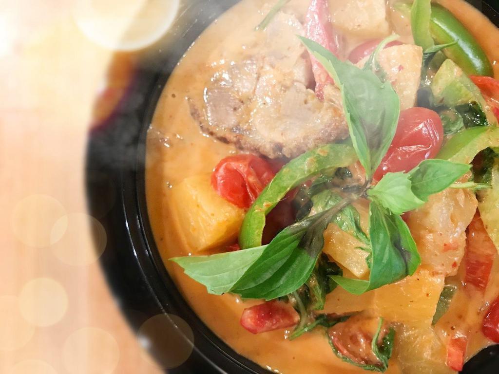 Duck Red Curry · Boneless duck in our Red curry sauce with basil leaves, bell peppers, tomatoes, pineapple and coconut milk.