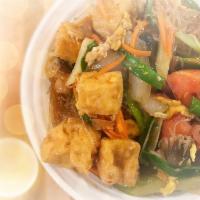 Pad Woon Sen · Cellophane noodles stir fried with your choice of meat with egg, tomatoes, onions, celery, c...