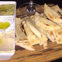 Spreads Trio Sampler · Served with naan bread. Gluten free.