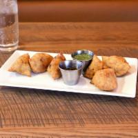 Samosa · Crispy pastries stuffed with potato, green chile, and cheese.